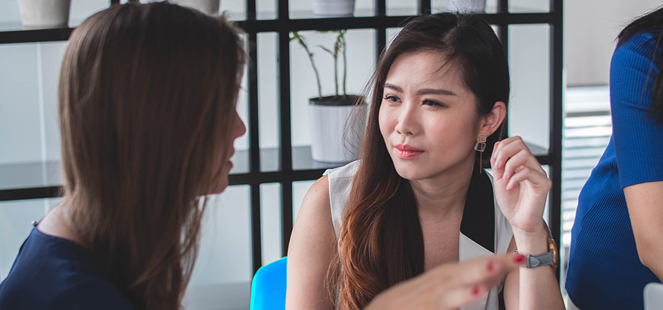 Women Chatting Office